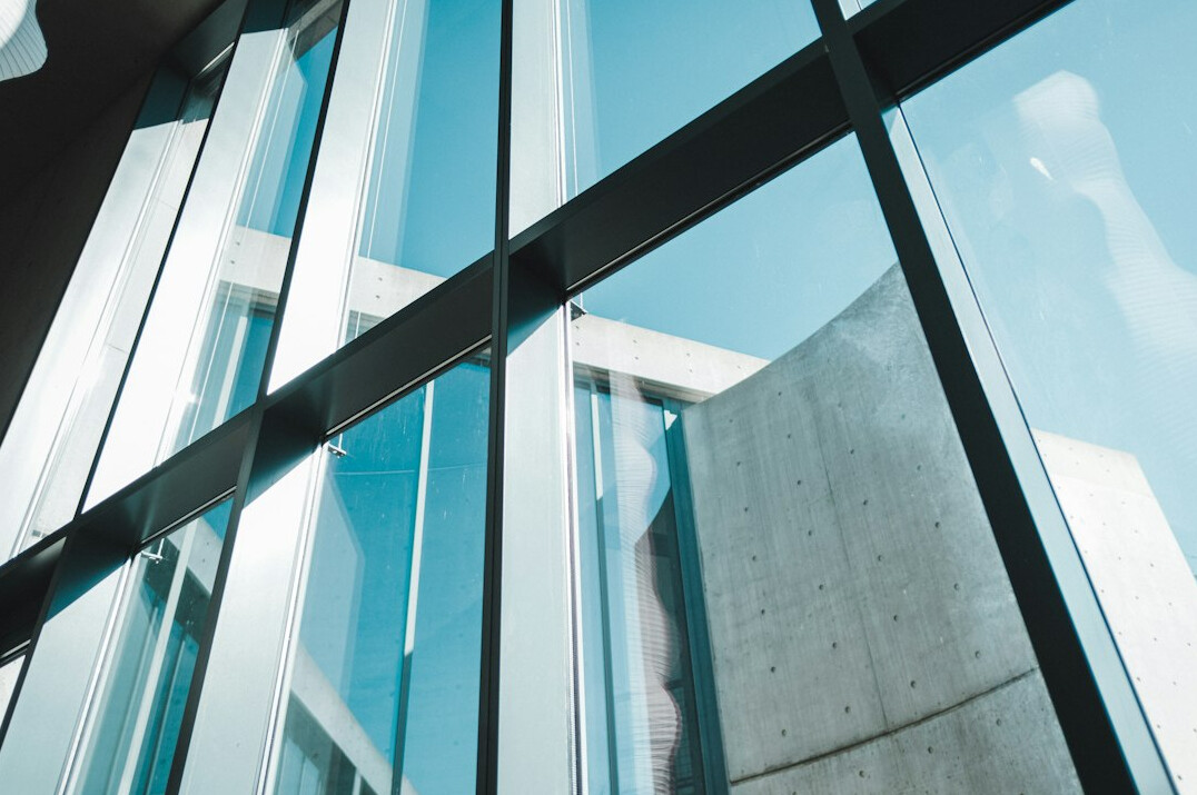 Modern glass office building facade in a European city